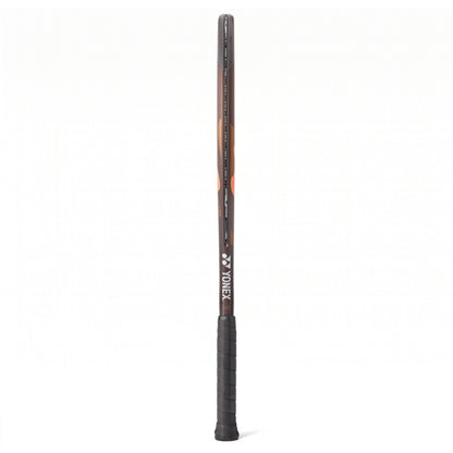 A side view of a brown and range Yonex tennis racket with a black grip on a white background