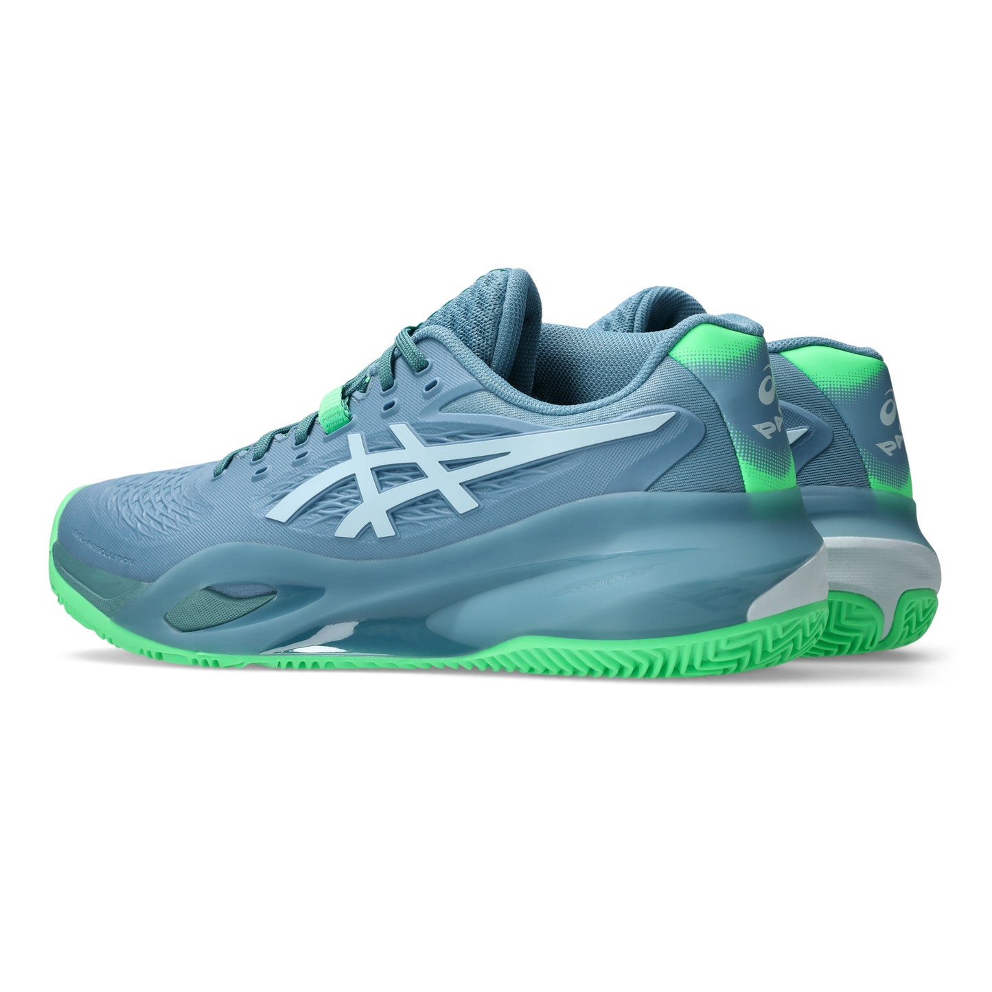 Blue padel shoes with green soles on a white background
