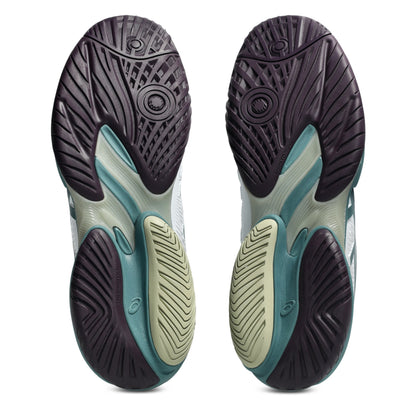 Black, and green tennis shoe sole with a tread pattern on a white background