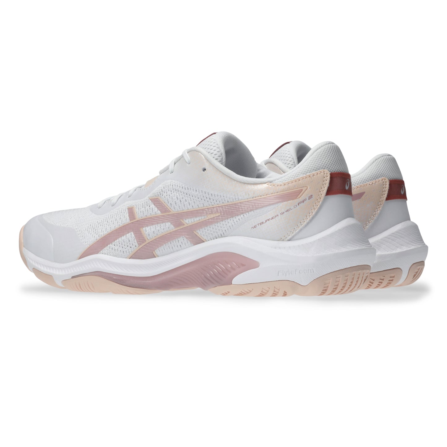 White and pink netball shoes on a white background