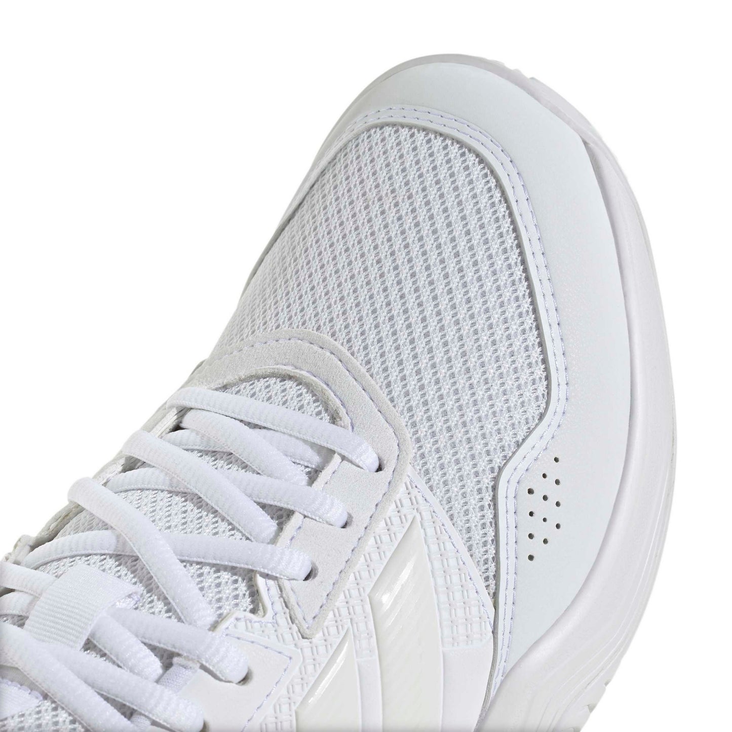 A close-up of a white tennis shoe showing the side profile, featuring a breathable mesh upper, white laces, and a thick white sole on a clean white background.