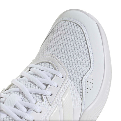 A close-up of a white tennis shoe showing the side profile, featuring a breathable mesh upper, white laces, and a thick white sole on a clean white background.