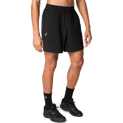 Man wearing black shorts with logo on right leg , on a white background