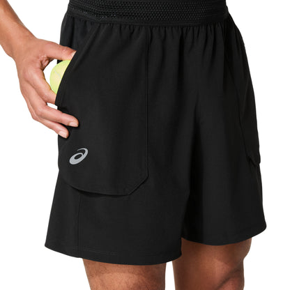 Man wearing black shorts with logo on right leg , on a white background