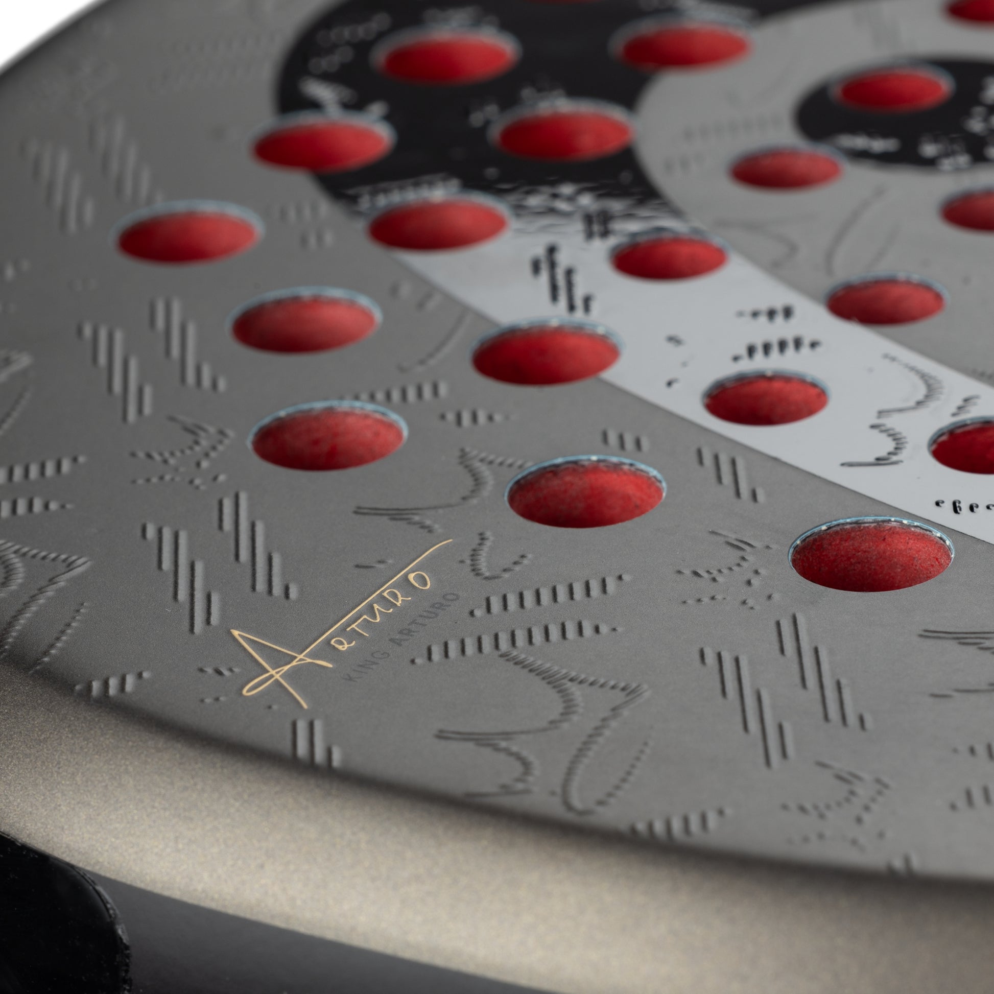 Close-up of a black and red patterned product with 'Aerello' branding.