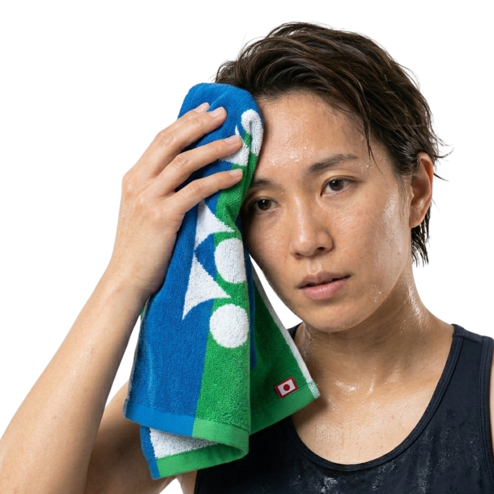 Person wiping face with a blue and green towel on a white background