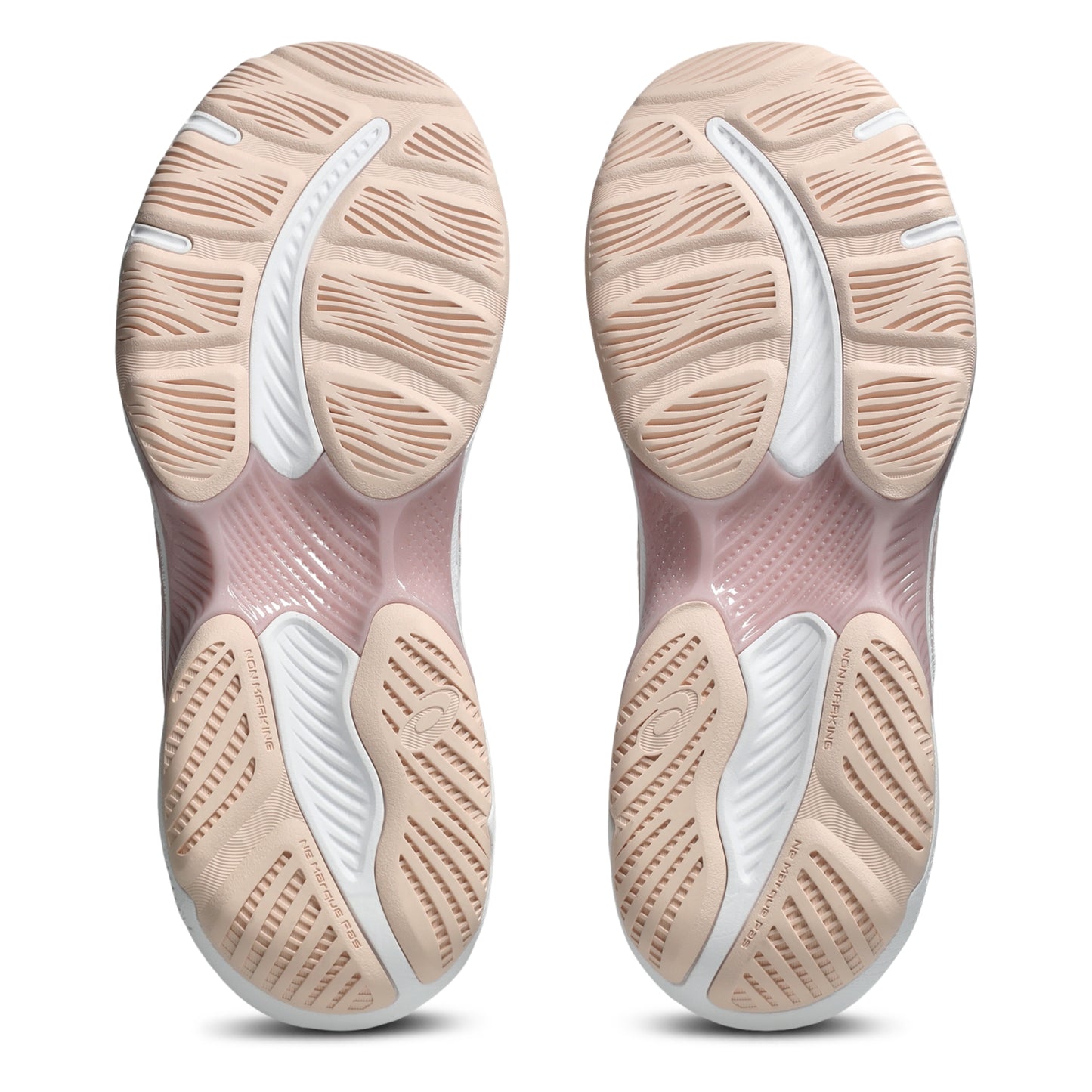 Close-up of a pair of netball shoe soles with a focus on the sole design.