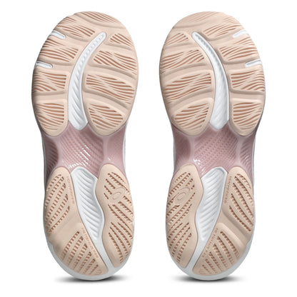 Close-up of a pair of netball shoe soles with a focus on the sole design.