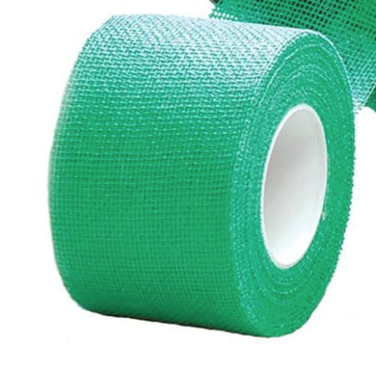 Roll of green tape on a white background