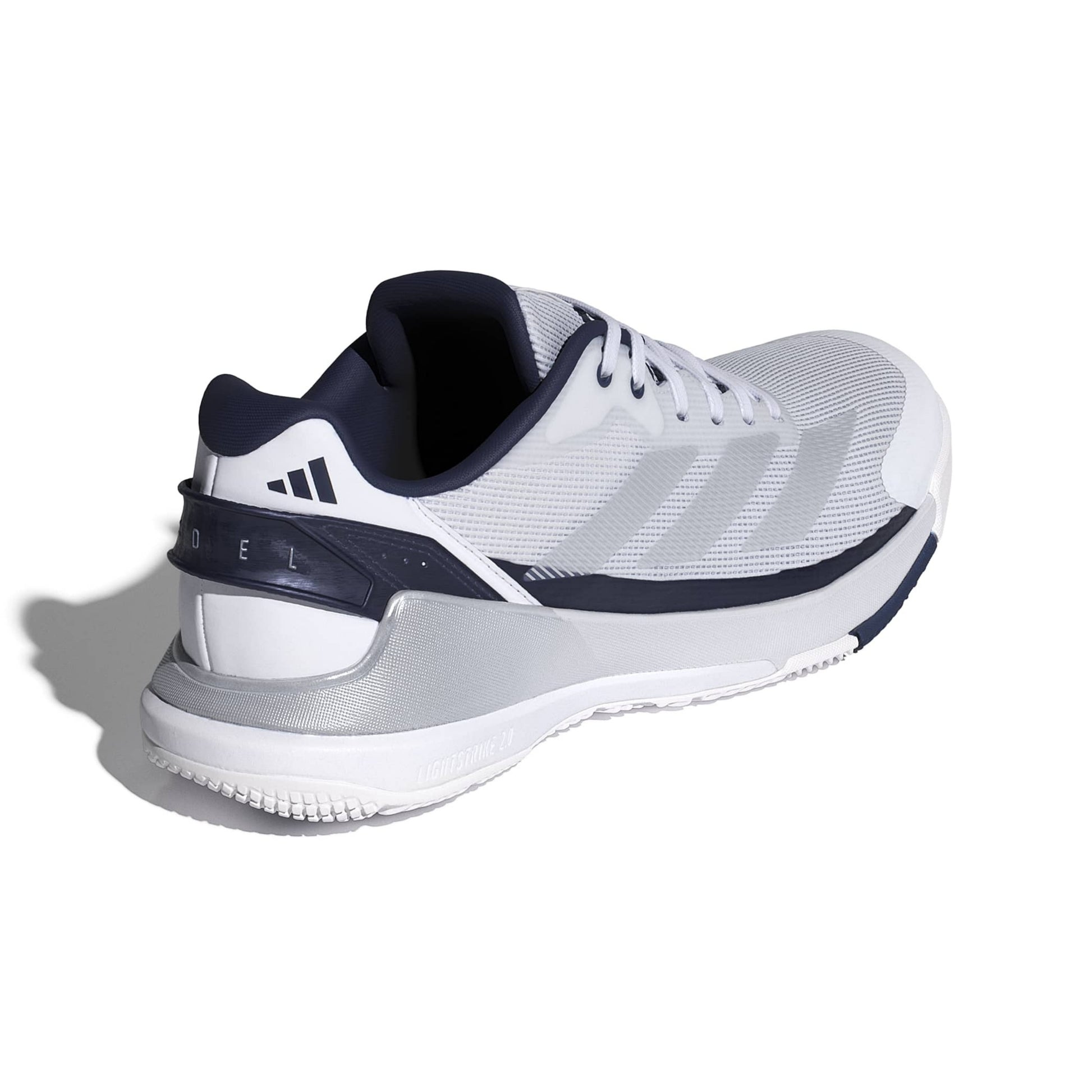 A white and navy blue Adidas padel shoe shown from a three-quarters rear angle on a white background with a soft shadow.