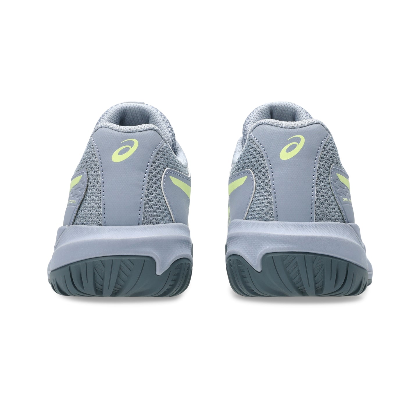 Gray tennis shoes with yellow accents on a white background