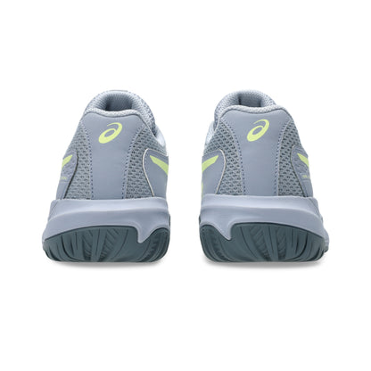 Gray tennis shoes with yellow accents on a white background