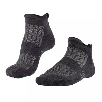 Pair of black Falke ankle socks with a textured pattern on a white background
