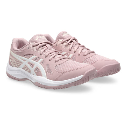 Pink athletic shoes with white soles on a white background