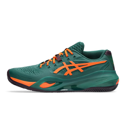 A dark green padel shoe with bright orange accents, including the ASICS logo and laces, shown in a side profile on a white background.