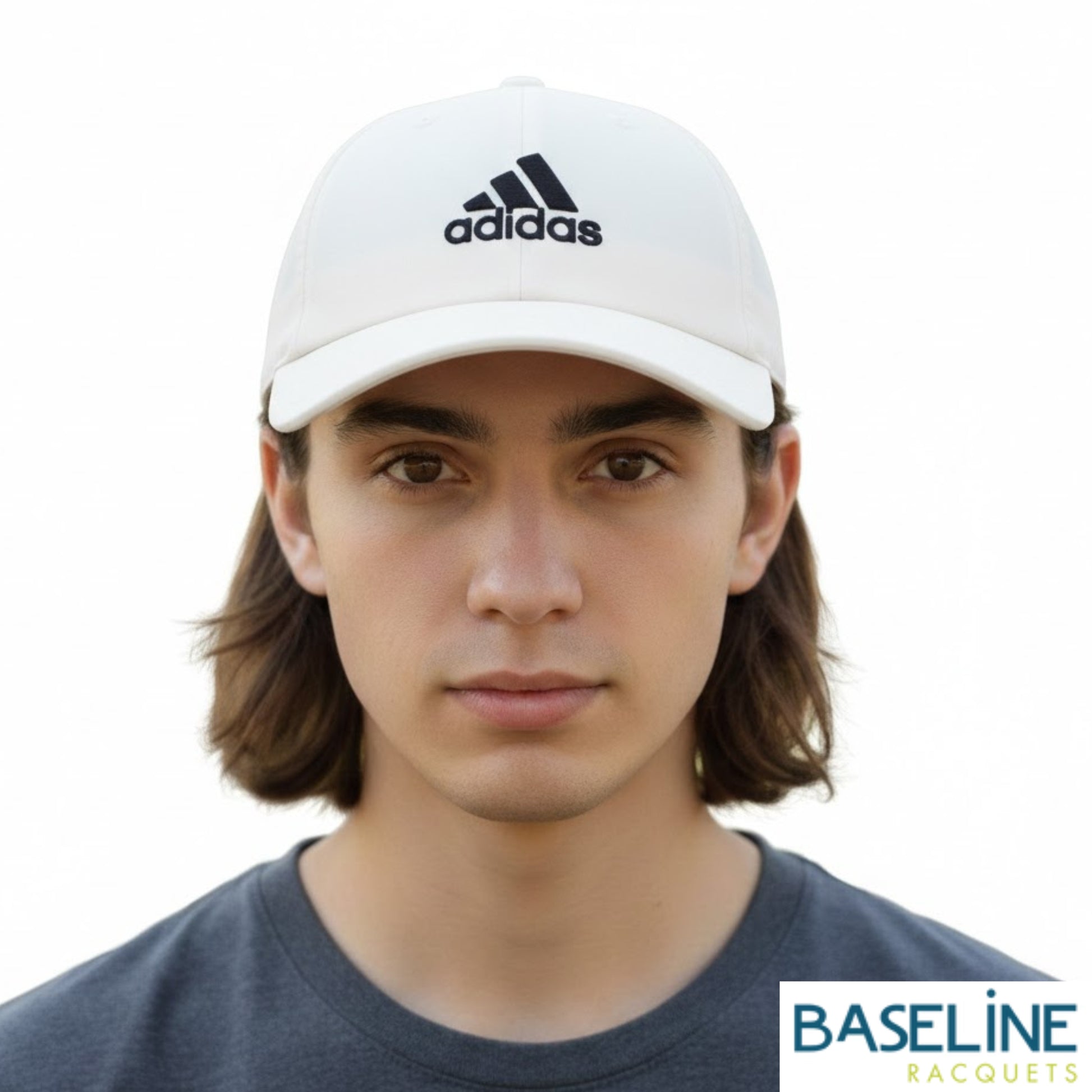 Person wearing white Adidas cap on a white background