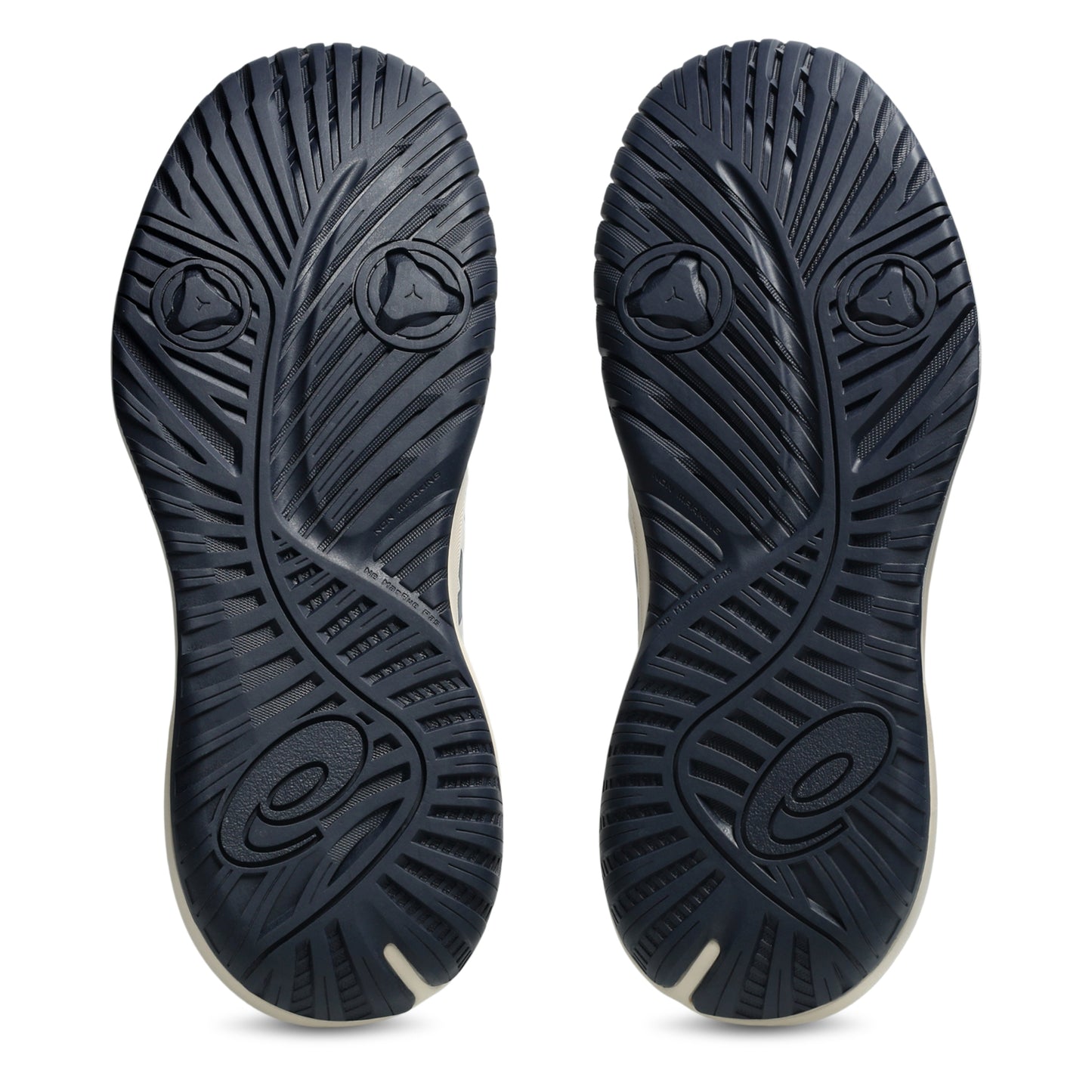 The outsoles of a pair of tennis shoes, shown from the bottom against a plain white background. The soles are dark navy blue with a textured, ribbed pattern and a small white accent line along the edge.