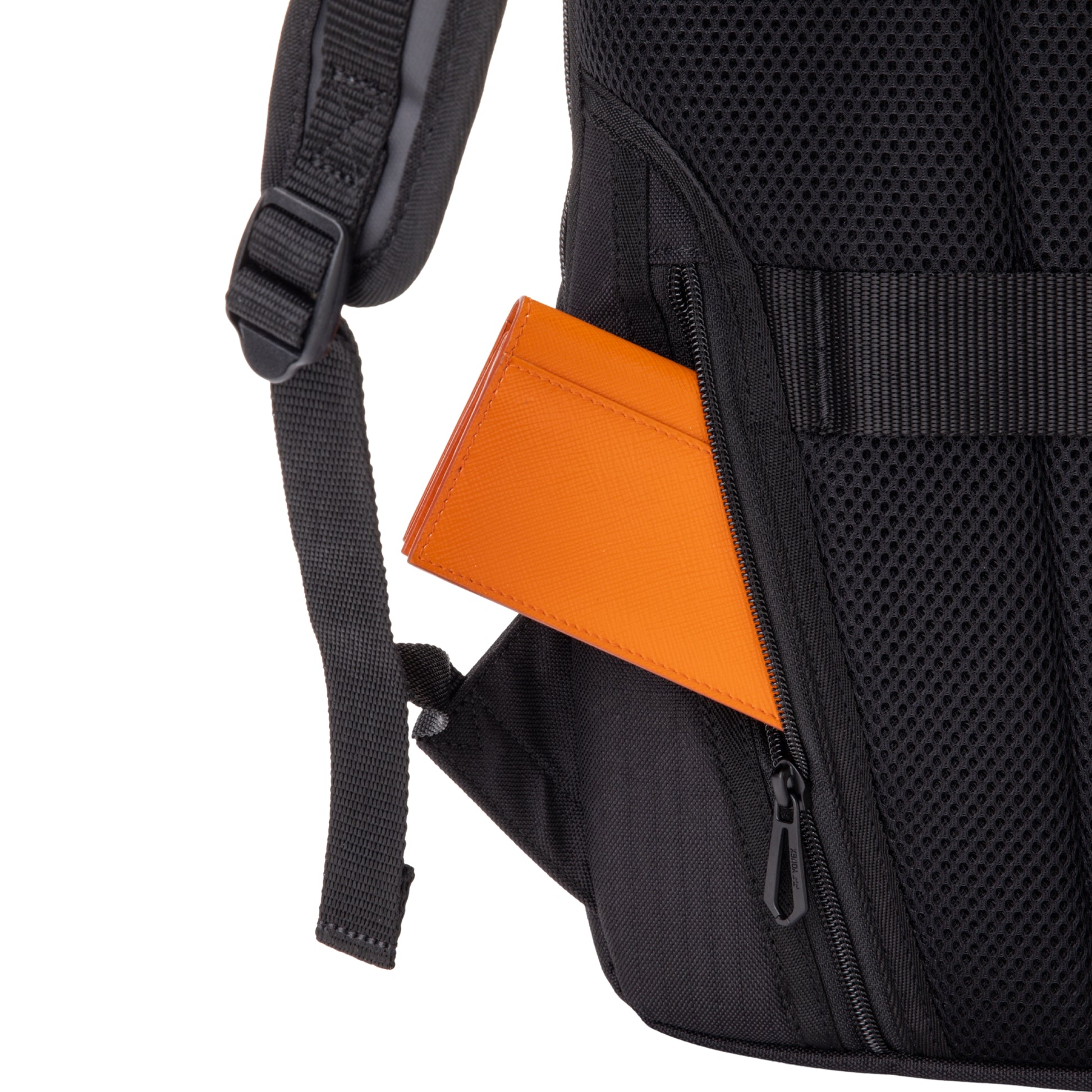 Black backpack with an orange item peeking out of a side pocket on a white background