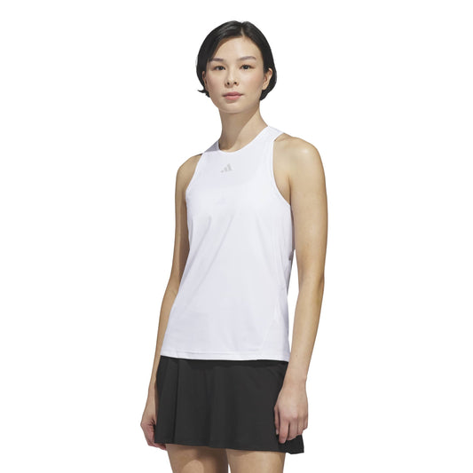 Woman wearing a white sleeveless adidas top with a logo on a white background