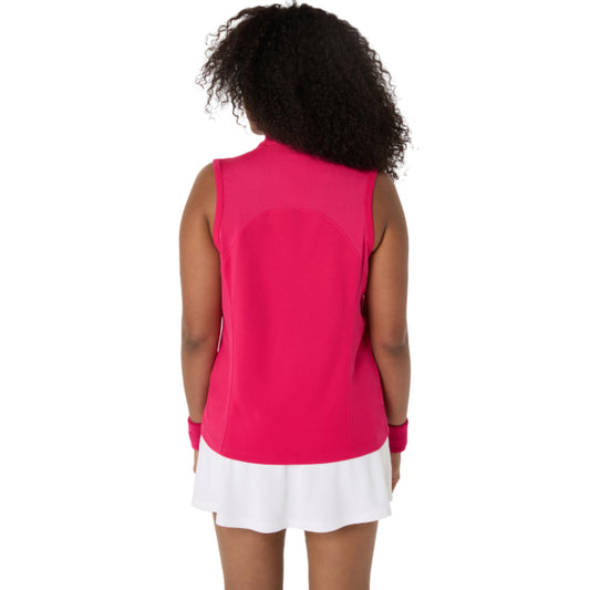 Person wearing a bright pink sleeveless top and white skirt on a white background