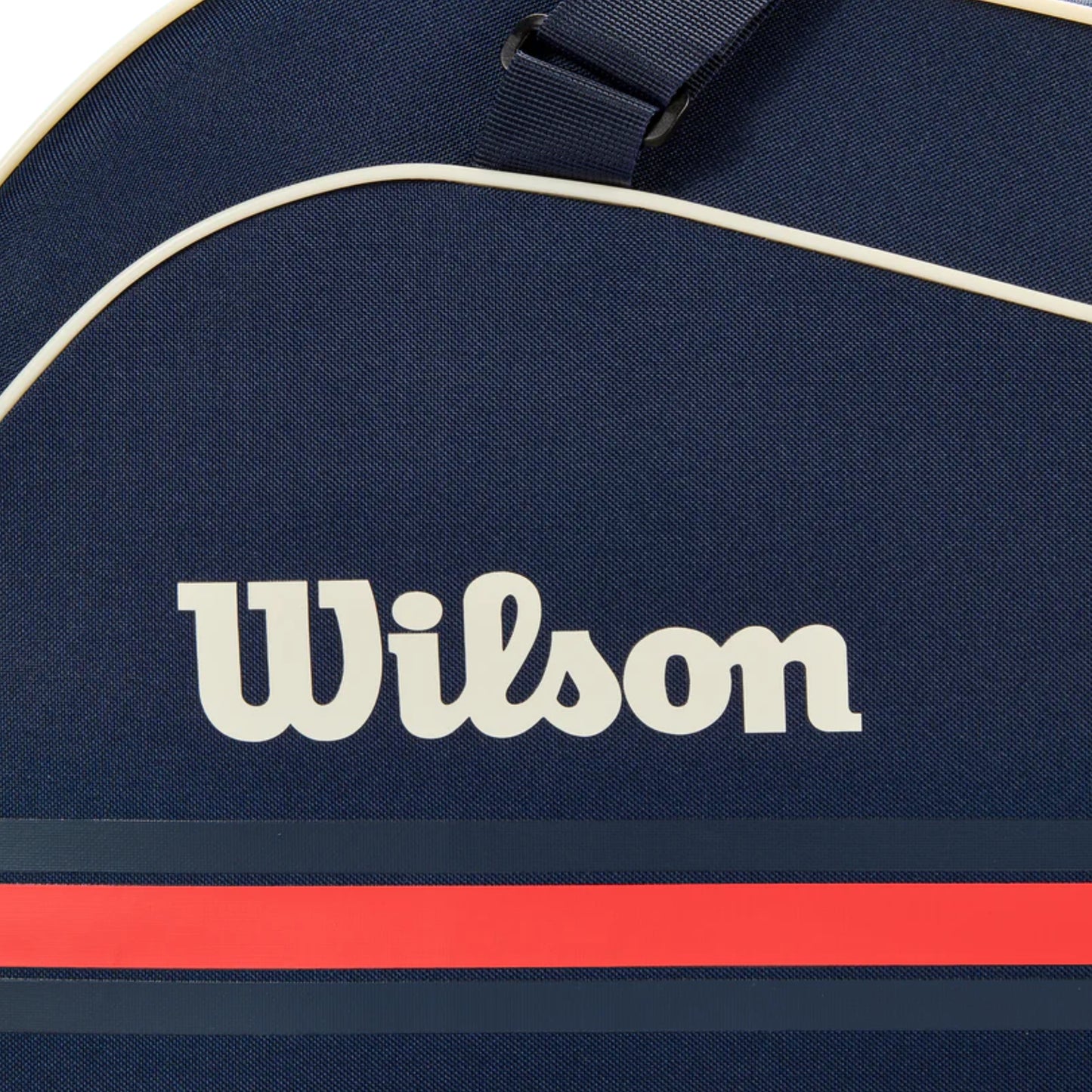 Navy blue tennis bag with Wilson logo and red stripe