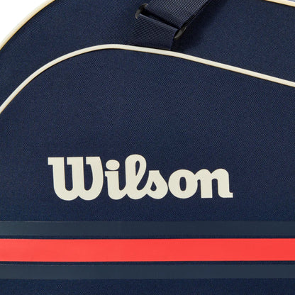 Navy blue tennis bag with Wilson logo and red stripe