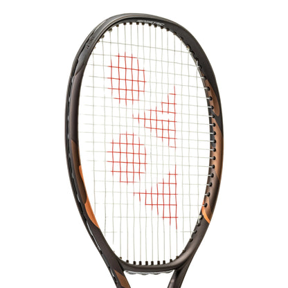 A close-up of a Yonex tennis racket head on a white background, featuring a dark brown and black frame with orange accents and red string patterns.