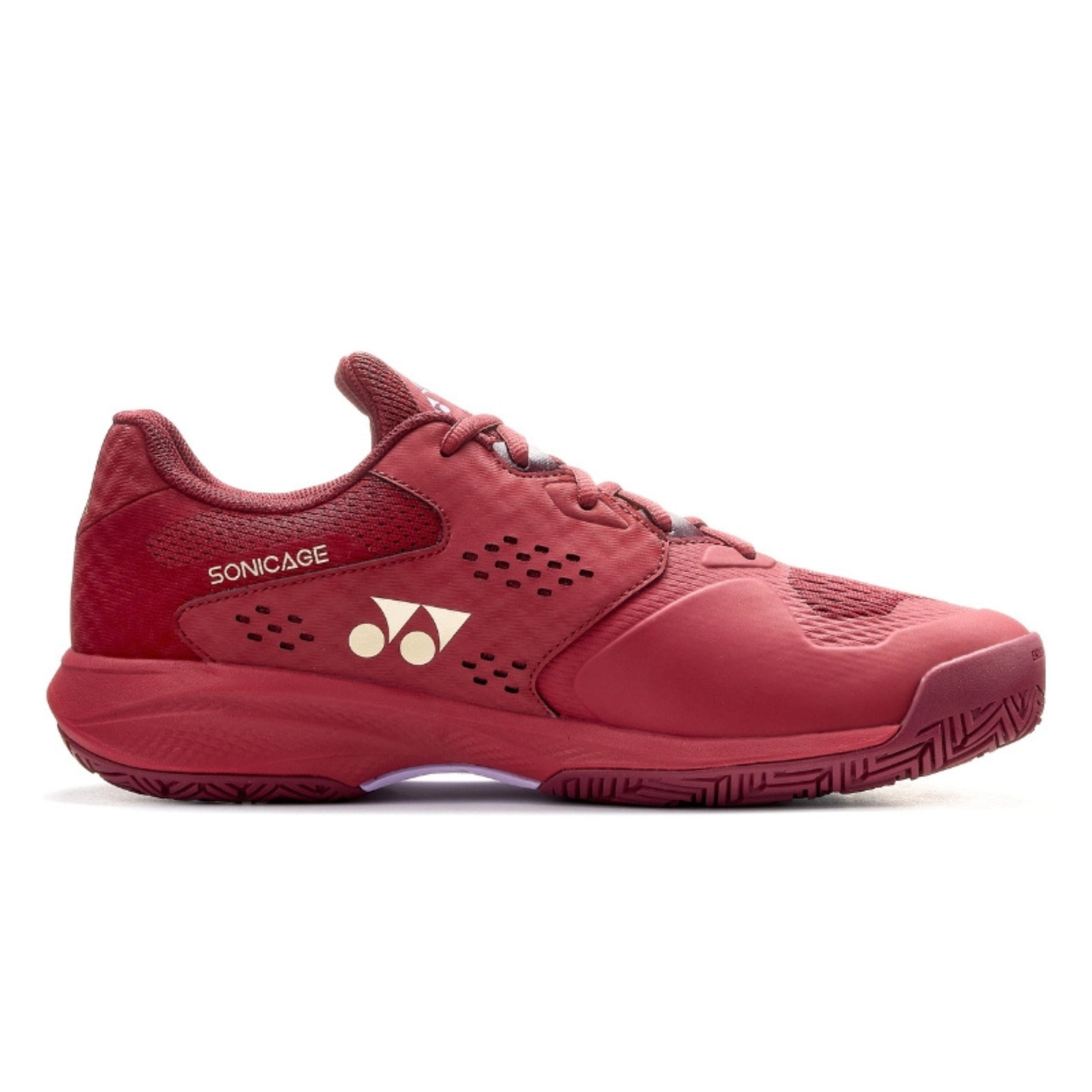 Red Yonex tennis shoe with brand logo on a white background