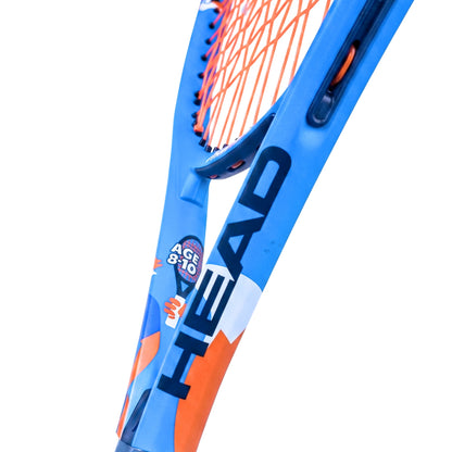 Close-up of a HEAD tennis racket showing the blue frame with orange and white accents, orange strings, and the HEAD logo on a white background.