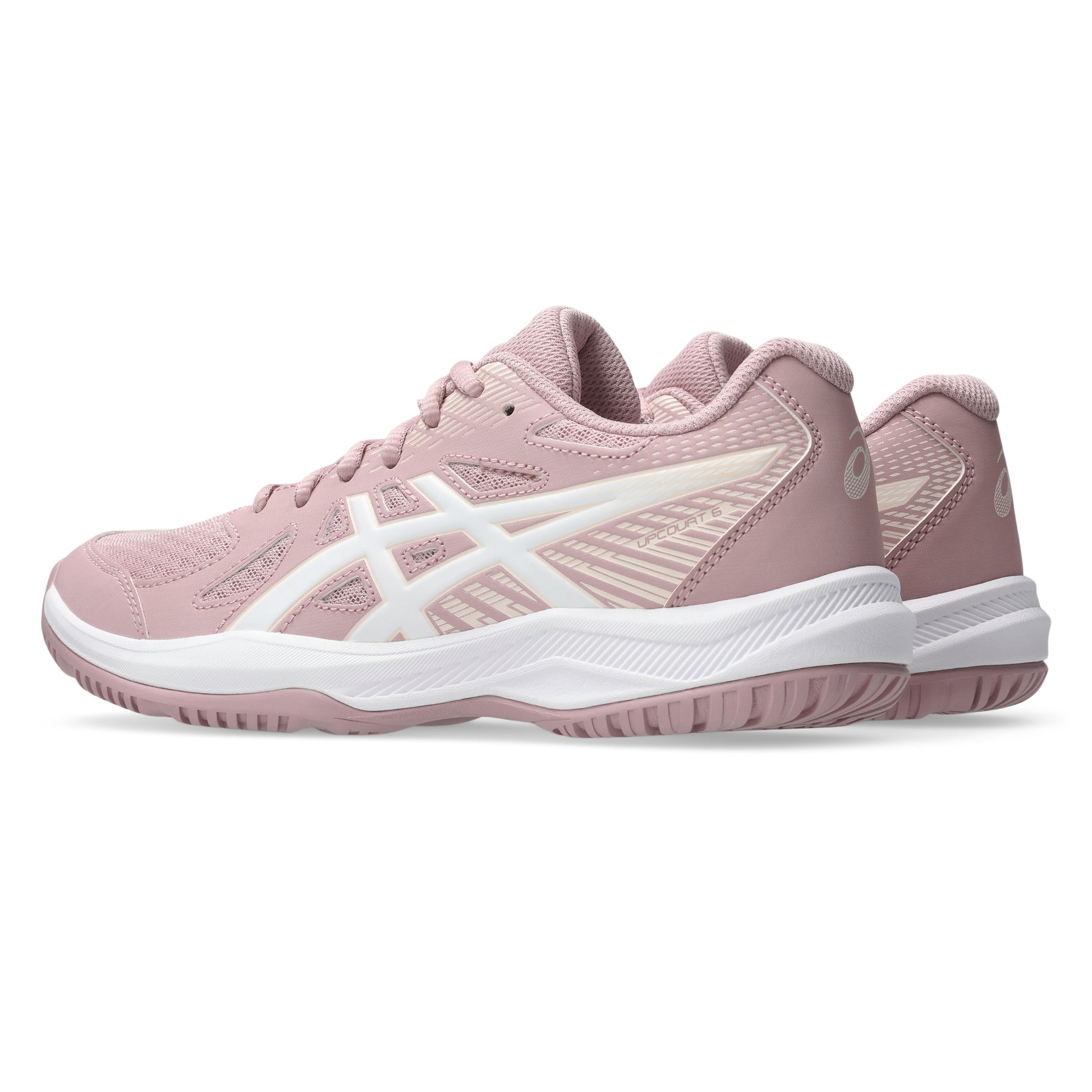 Pink athletic shoe with white sole on a white background