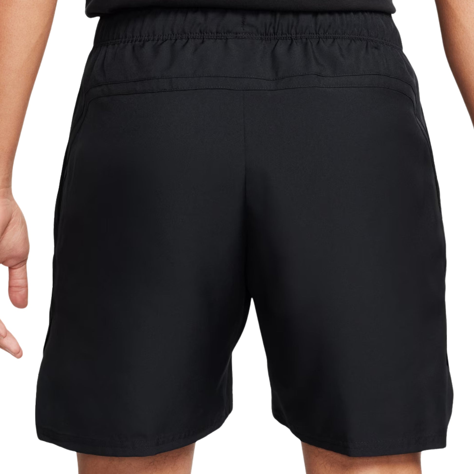 Black shorts worn by a person on a white background