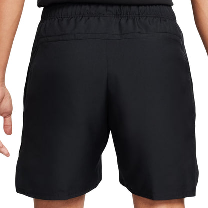 Black shorts worn by a person on a white background