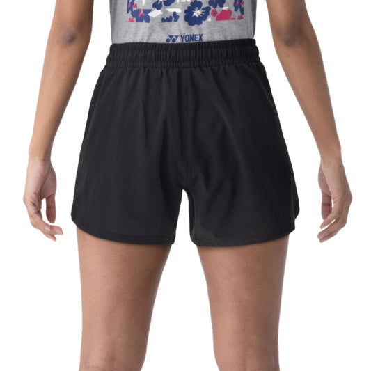 Black athletic Yonex shorts with a logo on a white background