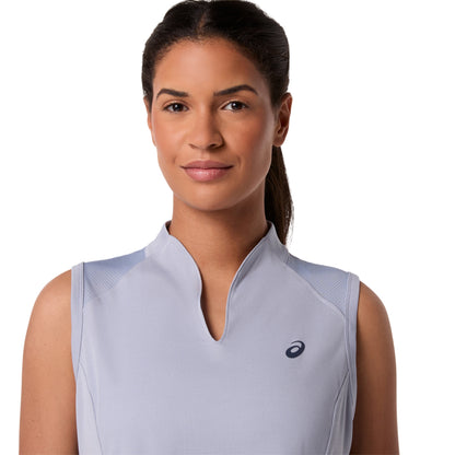 Woman wearing a light gray sleeveless Asics top with a brand logo on a white background