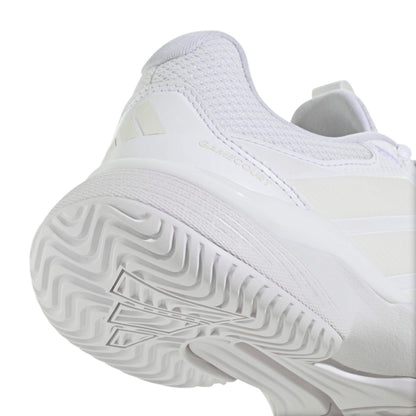 White Adidas tennis shoe with sole pattern on a white background