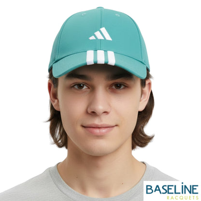 Person wearing teal cap with white stripes and Adidas logo on a white background