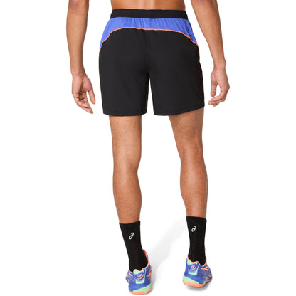 Person wearing black athletic shorts with blue and orange accents on a white background