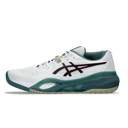 A white Asics tennis shoe with a dark teal midsole and heel, a dark burgundy logo on the side, and a light beige lace detail, shown against a plain white background.