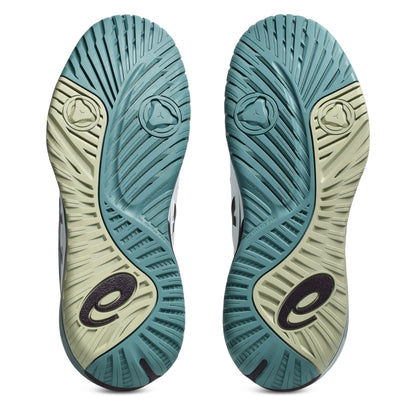 The outsoles of a pair of tennis shoes, showing a dual-tone design with teal blue and light sage green sections, featuring a black stylized 'e' logo near the heel.