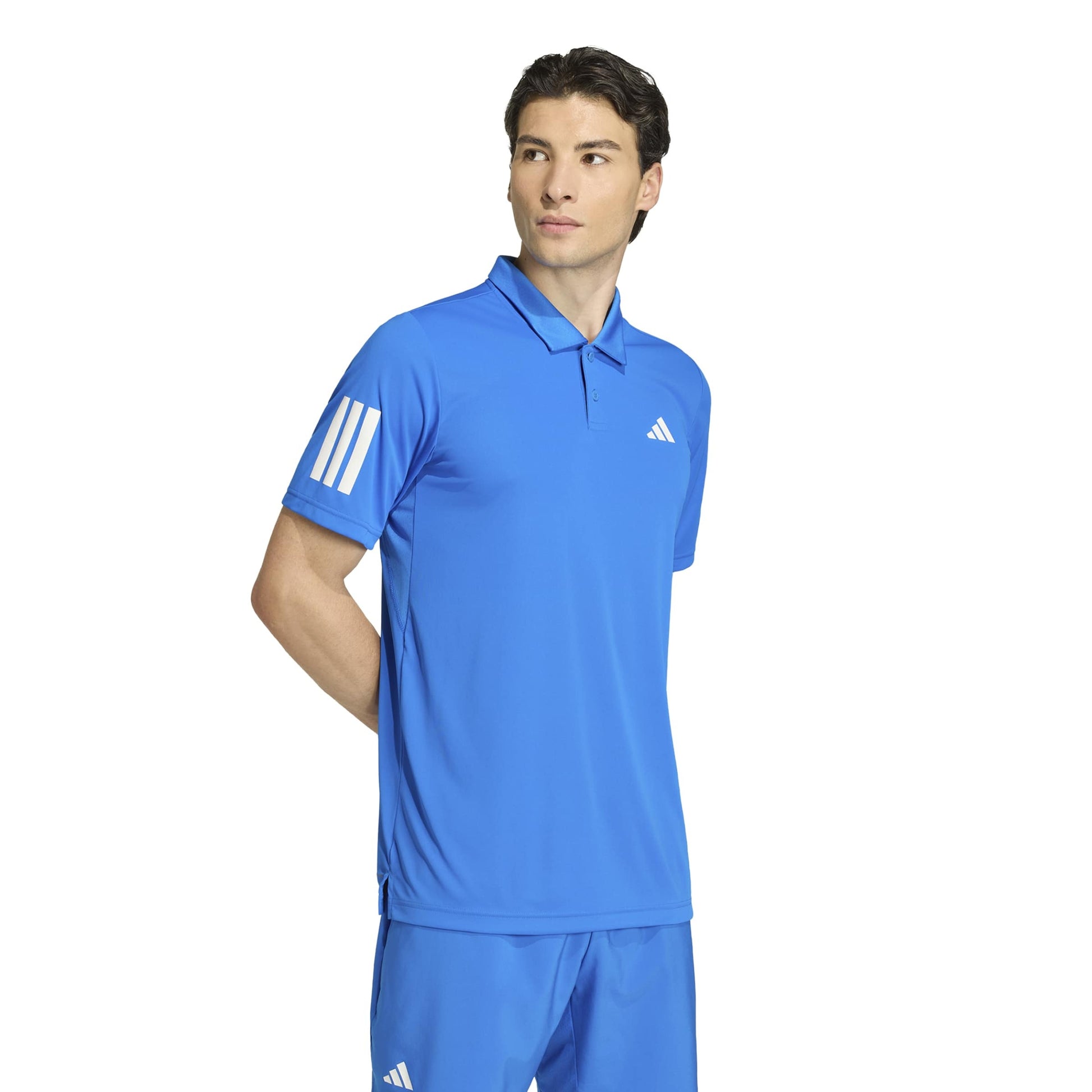 Man wearing a blue adidas polo shirt on a white background
