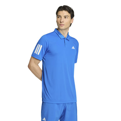 Man wearing a blue adidas polo shirt on a white background