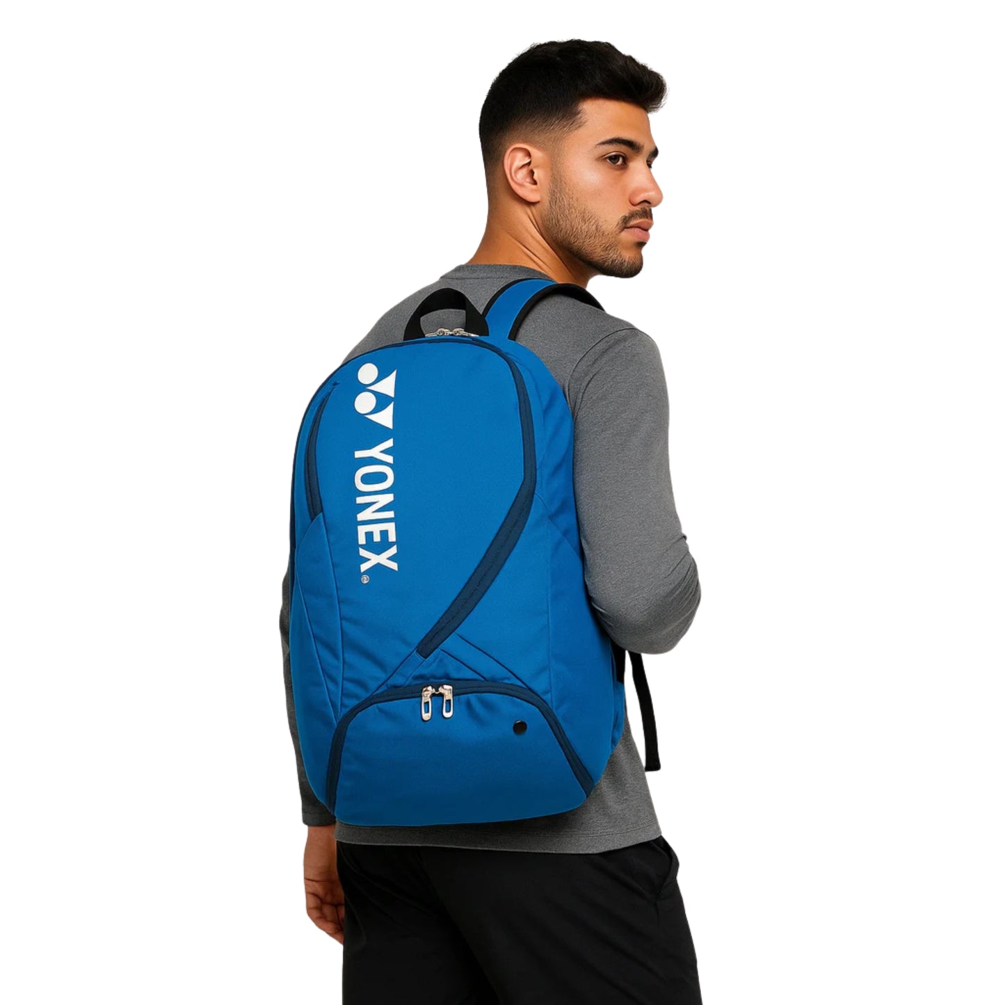 Man wearing a blue Yonex backpack on a white background